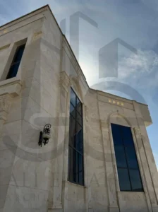Lumora luxury villa exterior with white travertine façade and horizontal canopy