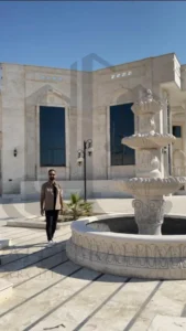 Lumora luxury villa exterior with white travertine façade and horizontal canopy