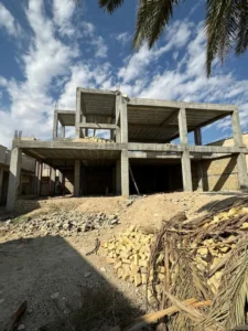 Installation of floor-to-ceiling windows for natural lighting.