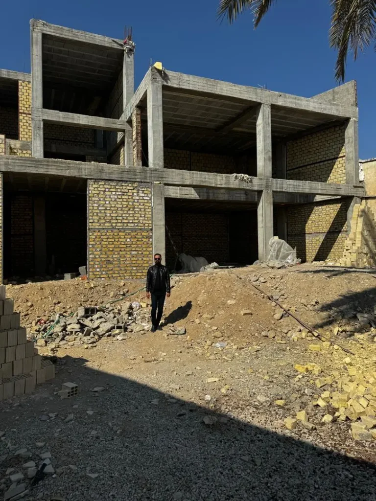 Aerial perspective of the house showing integration with natural surroundings.